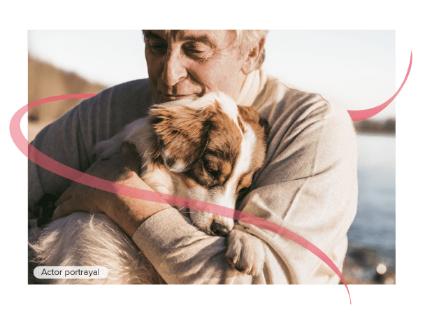 Actor portrayal of male oncology patient holding a dog