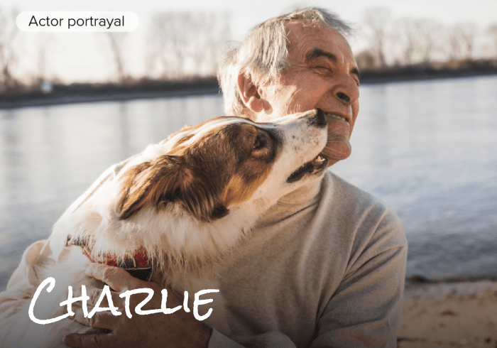 Actor portrayal of man with cancer outside with dog