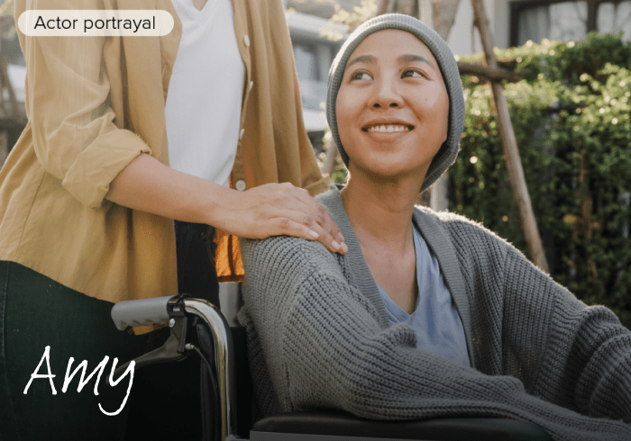 Actor portrayal of woman with cancer sitting outside